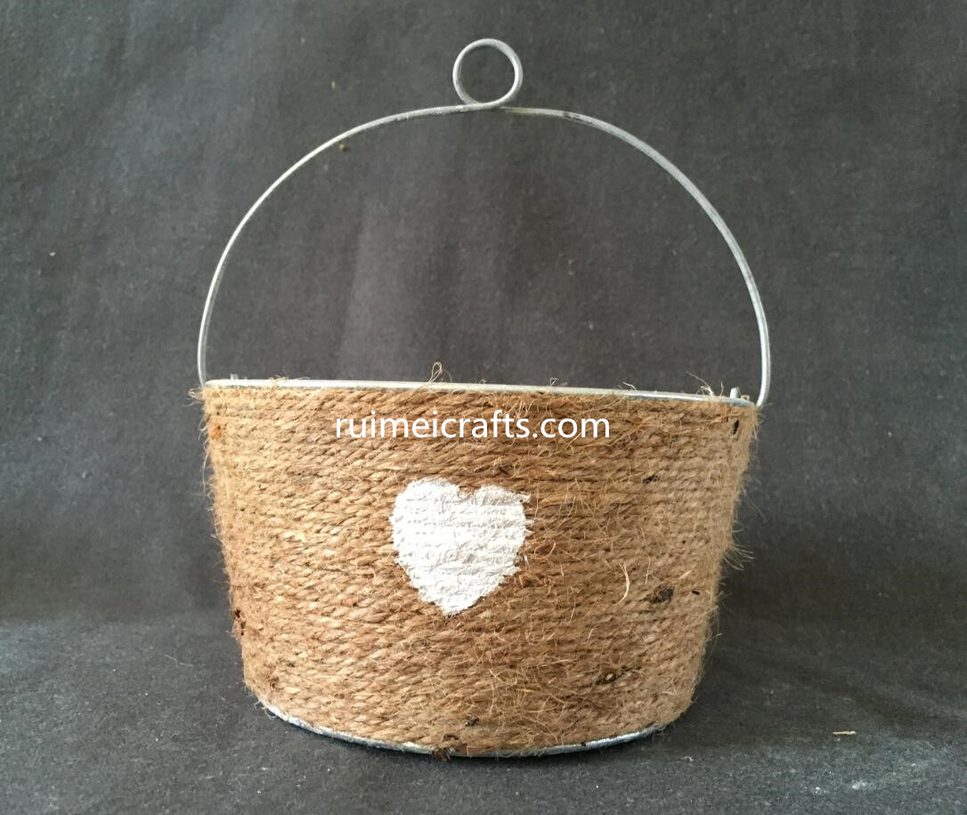 metal floral pot with sea grass decoration and handle.JPG