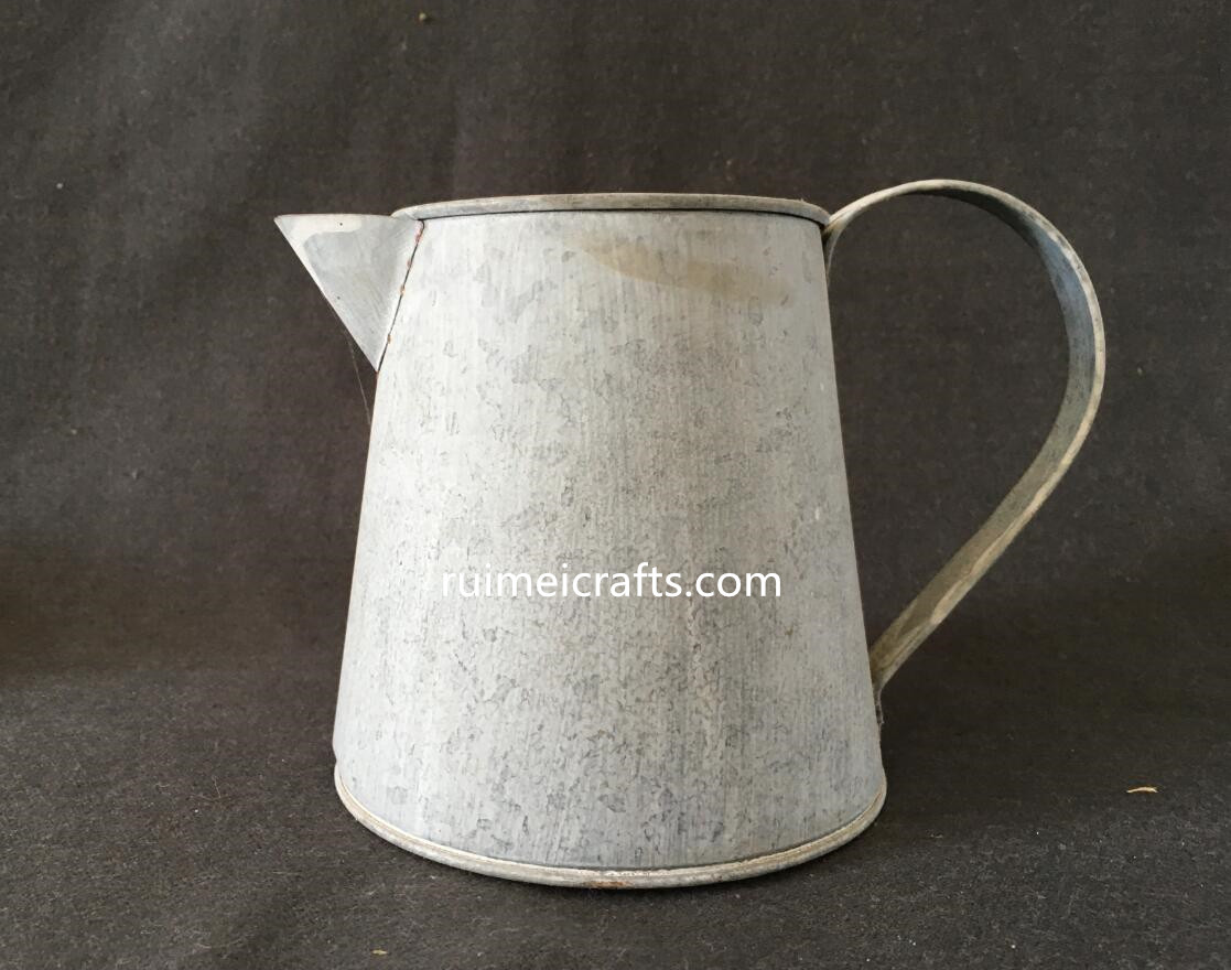 courtyard pastoral metallic watering can.JPG